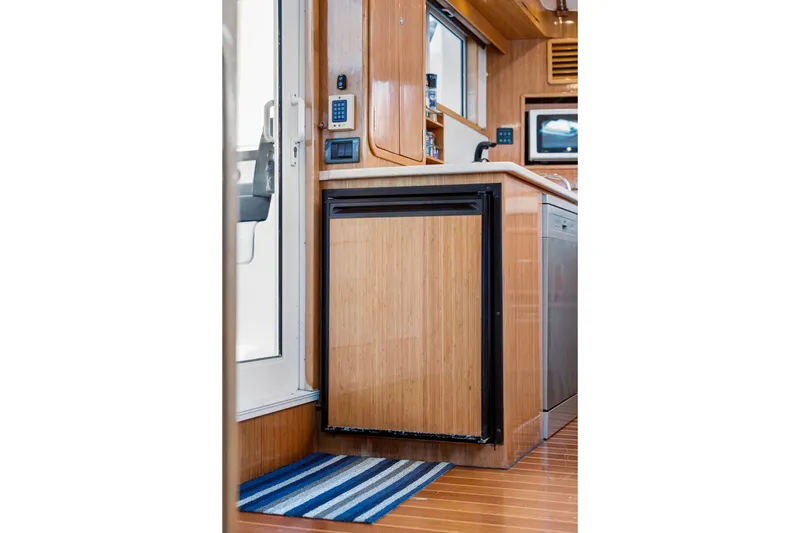 Slide: The Image of Modern kitchen interior of 2010 St Francis SF 50 yacht with wooden cabinetry and appliances. - 73