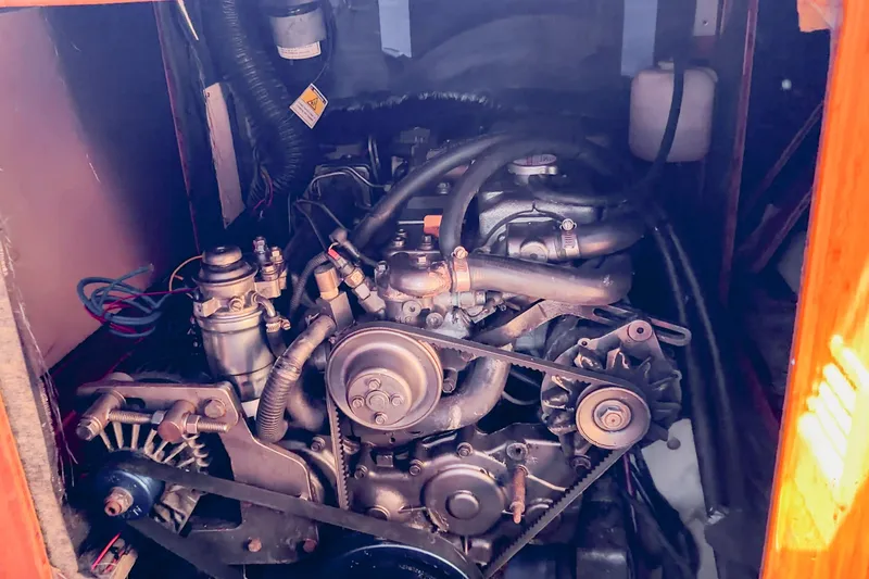 Slide: The Image of Engine compartment of a 2010 St Francis SF 50, showcasing mechanical components and belts. - 107