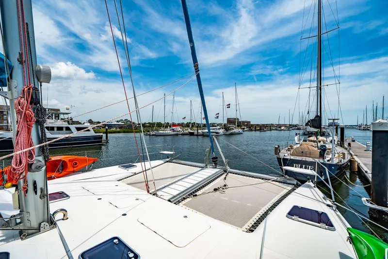 Slide: The Image of Catamaran docked in marina, St Francis SF 50, 2010 model, under clear blue sky. - 25