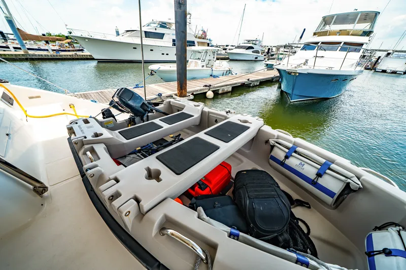 Slide: The Image of Small boat docked at marina with St Francis SF 50, 2010 model. - 57