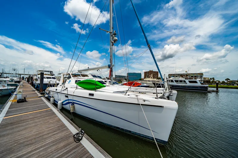 Slide: The Image of Sailboat St Francis SF 50, 2010 model, docked at marina under blue sky. - 19