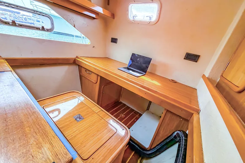 Slide: The Image of Cozy cabin interior of 2010 St Francis SF 50 yacht with wooden desk and laptop. - 97