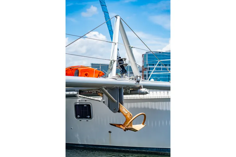 Slide: The Image of Sailboat St Francis SF 50, 2010 model, with anchor and lifebuoy, docked at marina. - 21