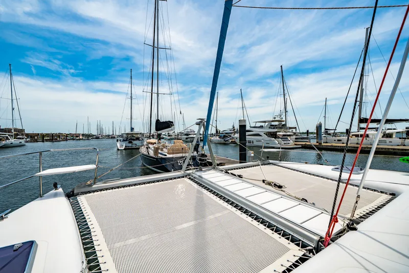 Slide: The Image of 2010 St Francis SF 50 catamaran docked in a marina with clear blue skies. - 30