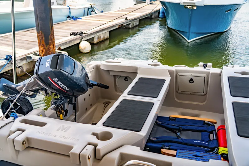 Slide: The Image of Small boat with Yamaha motor docked, featuring St Francis SF 50 model, 2010. - 58