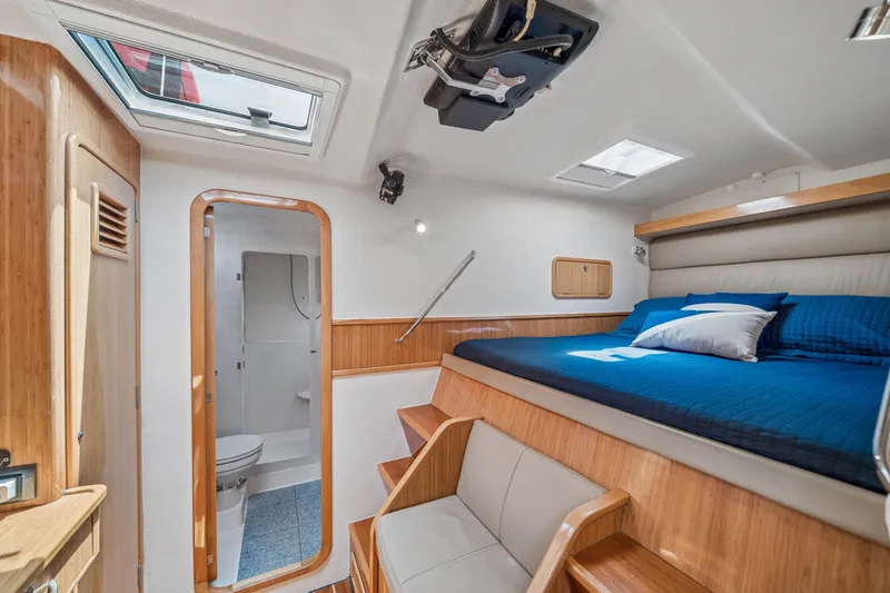 Slide: The Image of Luxurious 2010 St Francis SF 50 yacht cabin with bed, skylight, and bathroom. - 99