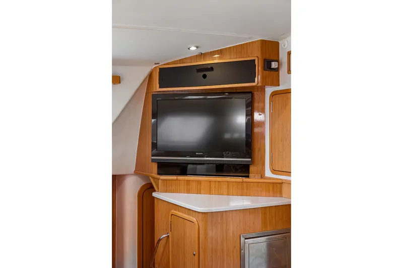 Slide: The Image of Interior of 2010 St Francis SF 50 yacht with mounted TV and wooden cabinetry. - 85