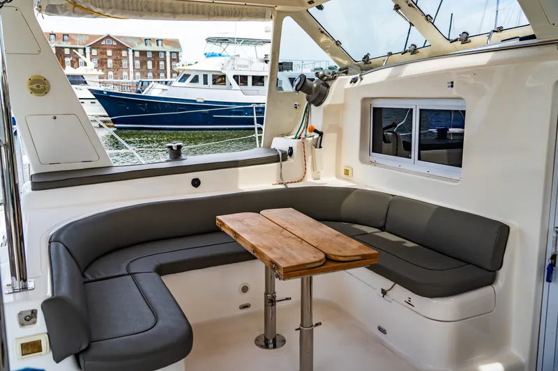Slide: The Image of Cozy seating area on 2010 St Francis SF 50 yacht with wooden table and marina view. - 42