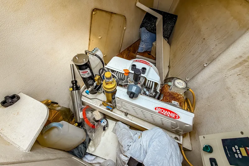 Slide: The Image of Brownie's compressor in a St Francis SF 50 boat, 2010 model, stored in a compartment. - 111