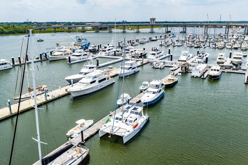 Slide: The Image of Boats docked at a marina, featuring a 2010 St Francis SF 50 catamaran. - 18