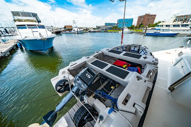 Slide: The Image of Docked St Francis SF 50 boat with outboard motor in a marina, 2010 model. - 55