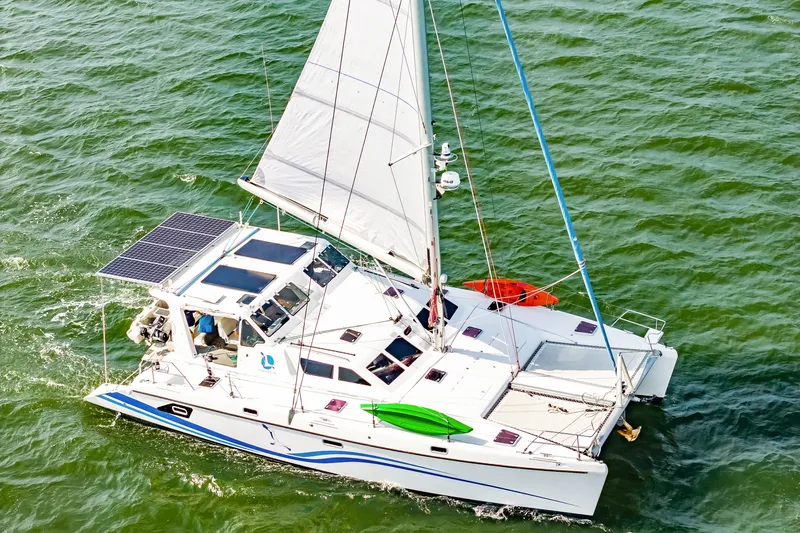 Slide: The Image of Sailing catamaran St Francis SF 50, 2010 model, with solar panels and kayaks on deck. - 6