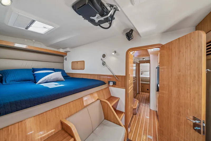 Slide: The Image of Luxurious cabin interior of 2010 St Francis SF 50 yacht with wooden finishes and cozy bedding. - 101