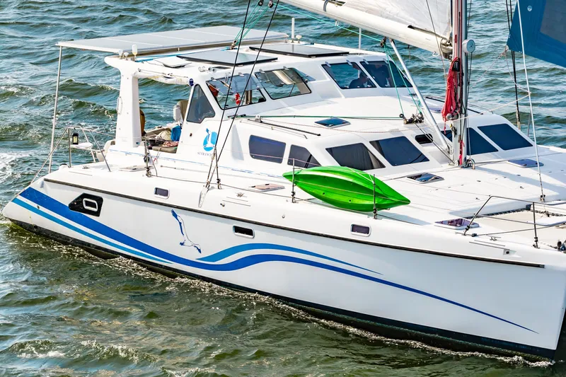 Slide: The Image of Sailing catamaran St Francis SF 50, 2010 model, cruising on open water with vibrant design. - 11