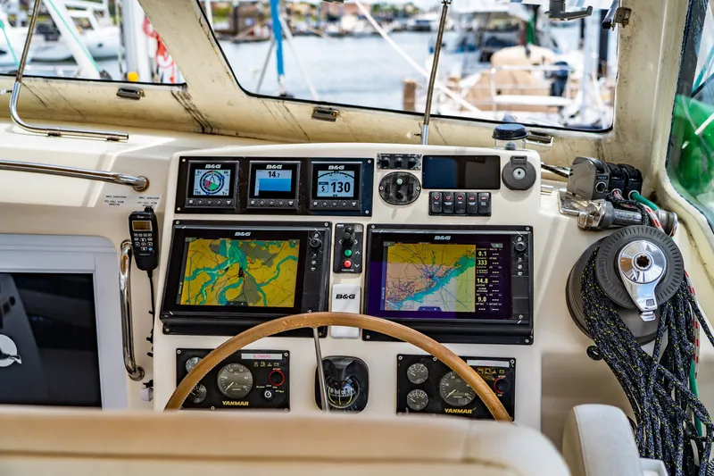 Slide: The Image of Cockpit of 2010 St Francis SF 50 yacht with navigation displays and steering wheel. - 48