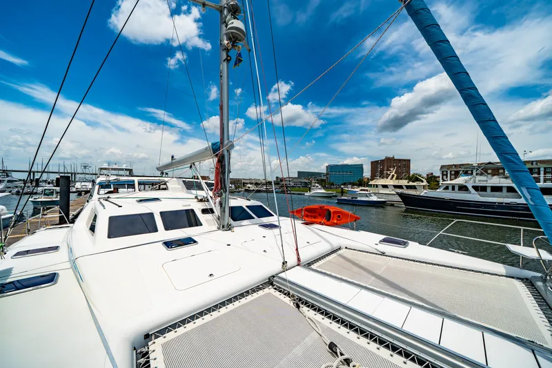 Slide: The Image of 2010 St Francis SF 50 catamaran docked at marina under blue sky. - 28