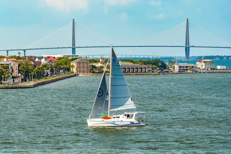 Slide: The Image of Sailboat St Francis SF 50 on water with bridge and cityscape in background, 2010 model. - 3