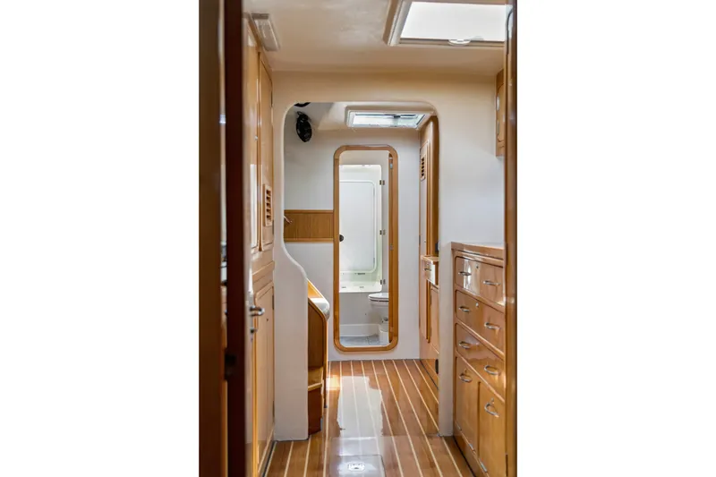 Slide: The Image of Interior of 2010 St Francis SF 50 yacht, featuring wooden cabinetry and flooring. - 90