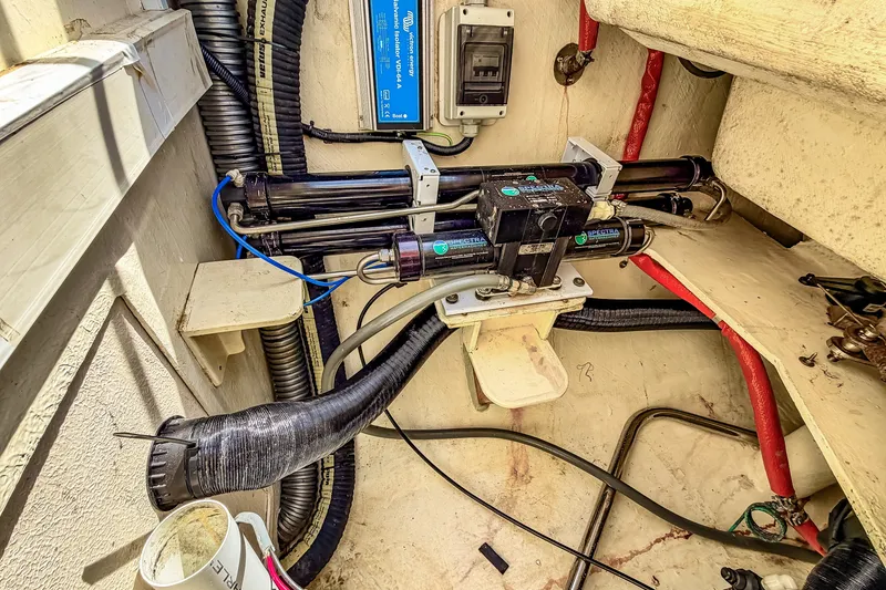 Slide: The Image of Engine compartment of a 2010 St Francis SF 50, showcasing wiring and mechanical components. - 112