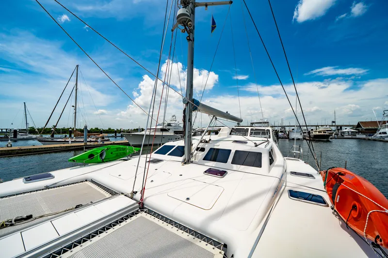 Slide: The Image of Catamaran St Francis SF 50, 2010 model, docked at marina under blue sky. - 31