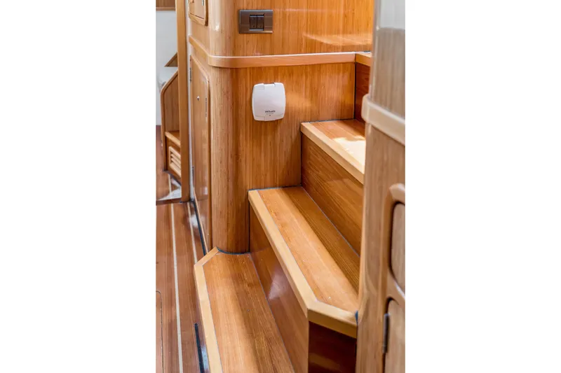 Slide: The Image of Wooden interior stairs of 2010 St Francis SF 50 yacht, featuring sleek design and polished finish. - 105