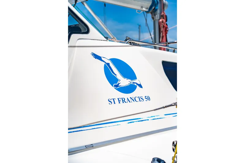 Slide: The Image of Sailboat with St Francis SF 50 logo, 2010 model, featuring a blue bird design. - 23