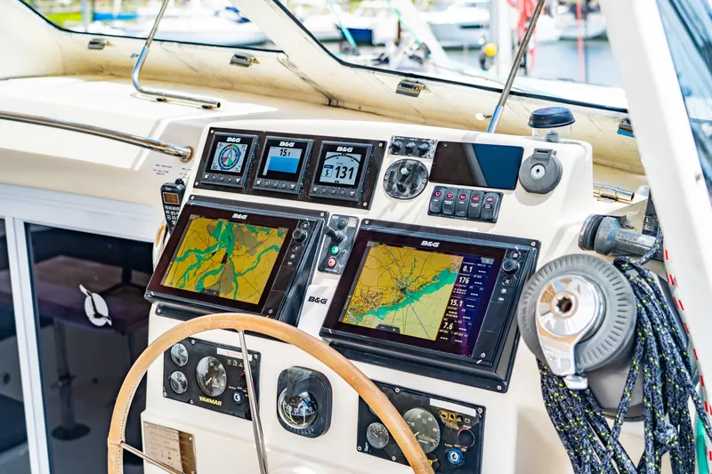 Slide: The Image of St Francis SF 50 yacht cockpit with navigation screens and steering wheel, 2010 model. - 53