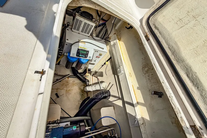 Slide: The Image of Engine compartment of a 2010 St Francis SF 50 boat, showcasing mechanical components. - 115