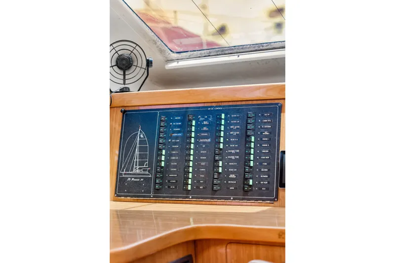 Slide: The Image of Control panel of a 2010 St Francis SF 50 yacht, featuring various switches and indicators. - 79