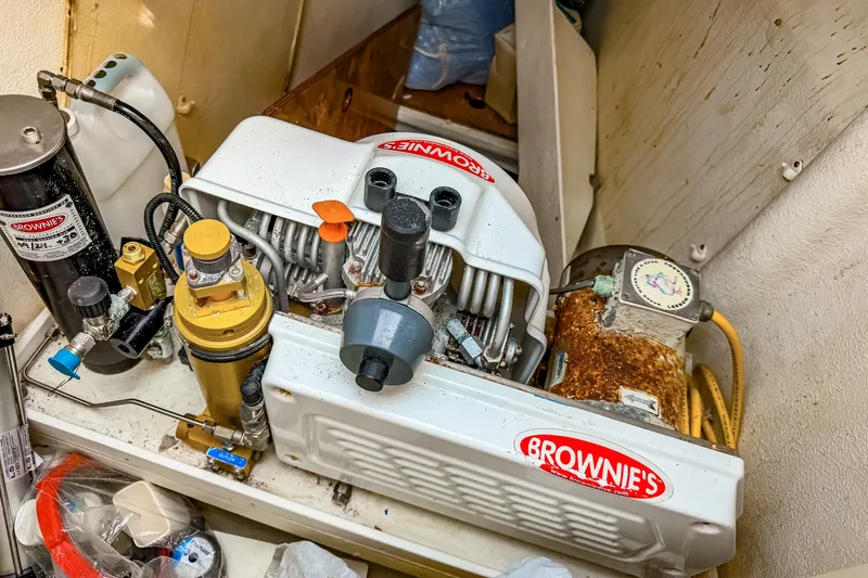 Slide: The Image of Brownie's air compressor system in St Francis SF 50, 2010 model, marine equipment setup. - 110