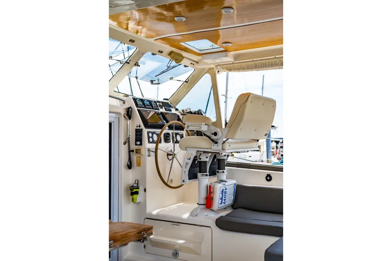 Slide: The Image of Cockpit of 2010 St Francis SF 50 yacht with steering wheel and navigation instruments. - 47