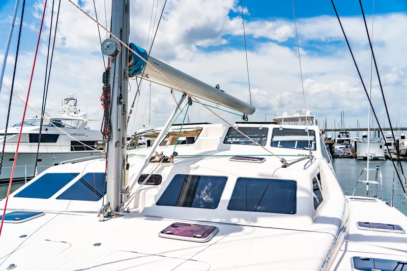 Slide: The Image of 2010 St Francis SF 50 catamaran docked at marina under blue sky. - 33