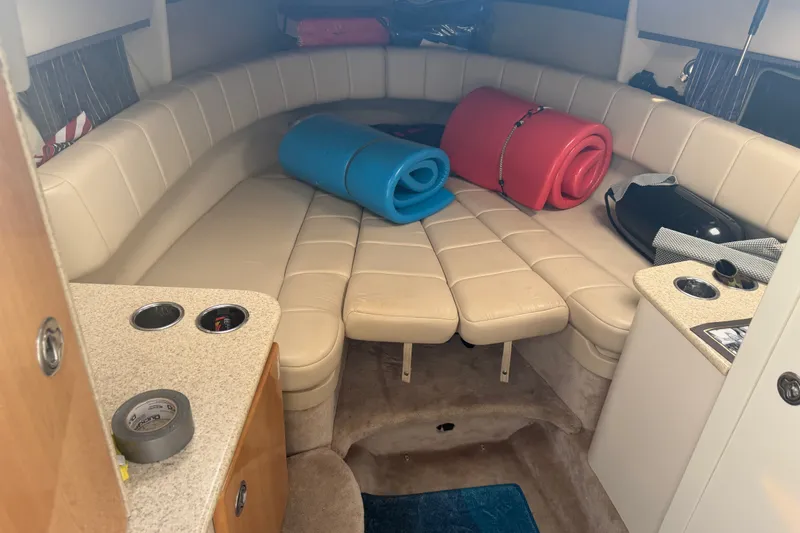 Slide: The Image of Interior of a 2003 Formula 330 Sun Sport boat with seating and rolled mats. - 27