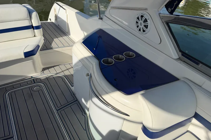 Slide: The Image of 2003 Formula 330 Sun Sport boat interior with seating and cup holders. - 15