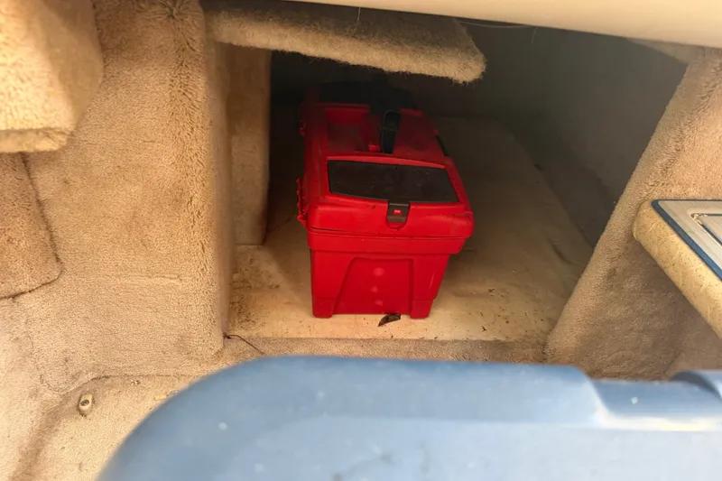 Slide: The Image of Red toolbox inside a 2003 Formula 330 Sun Sport boat compartment. - 32