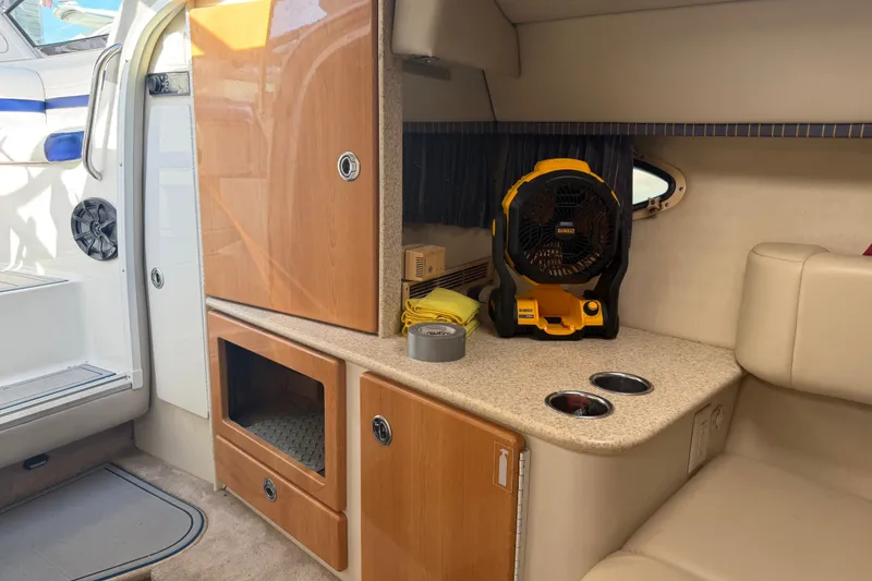 Slide: The Image of Interior of 2003 Formula 330 Sun Sport boat with cabinets and fan. - 30