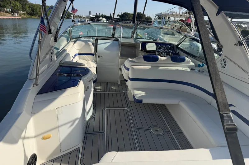 Slide: The Image of 2003 Formula 330 Sun Sport boat interior with seating and navigation equipment. - 9