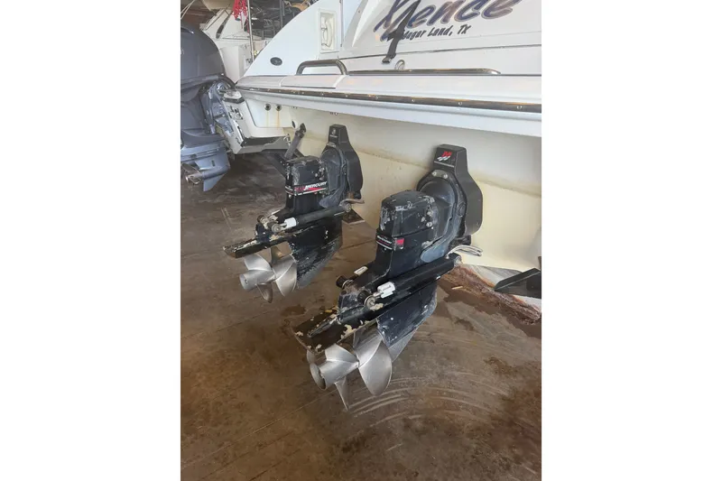 Slide: The Image of 2003 Formula 330 Sun Sport boat with dual Mercury outboard engines. - 43