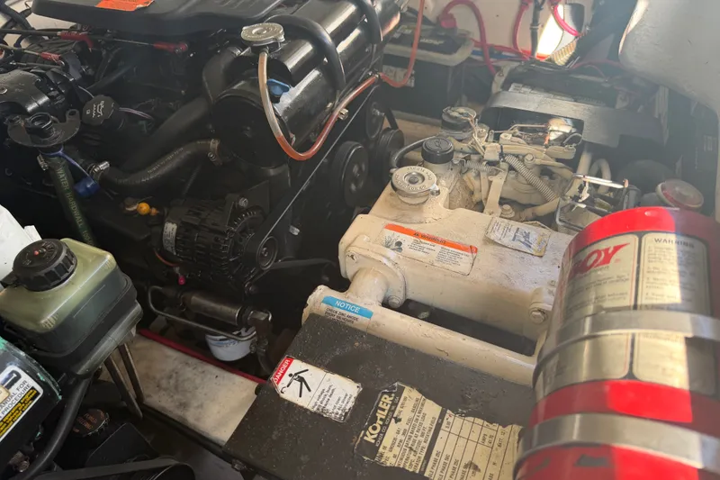 Slide: The Image of Engine compartment of a 2003 Formula 330 Sun Sport boat, showcasing mechanical components. - 40