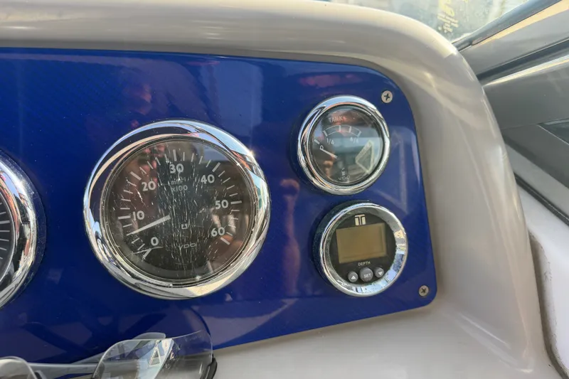 Slide: The Image of Dashboard of a 2003 Formula 330 Sun Sport boat with gauges and controls. - 25