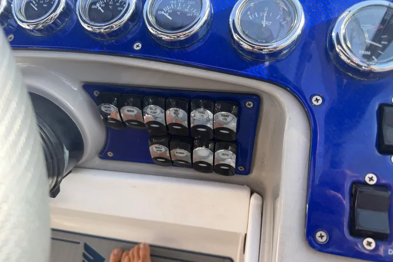 Slide: The Image of Dashboard controls of a 2003 Formula 330 Sun Sport boat with gauges and switches. - 17