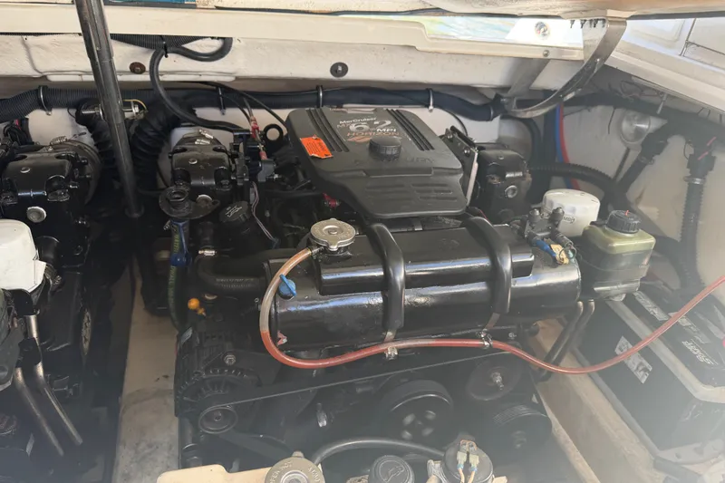 Slide: The Image of Engine compartment of a 2003 Formula 330 Sun Sport boat, showcasing dual engines. - 38