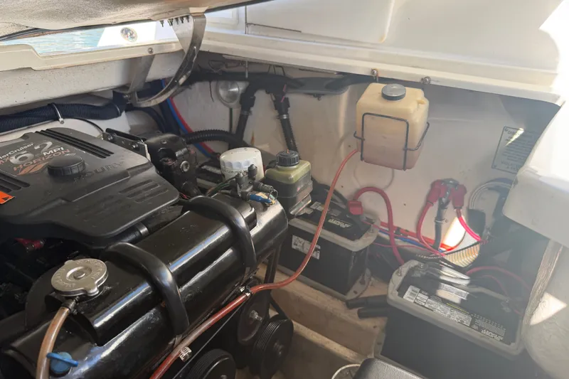 Slide: The Image of Engine compartment of a 2003 Formula 330 Sun Sport boat, featuring a MerCruiser engine. - 41