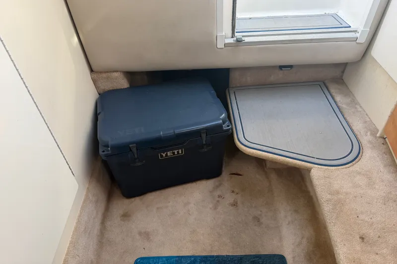 Slide: The Image of YETI cooler inside a 2003 Formula 330 Sun Sport boat cabin. - 31