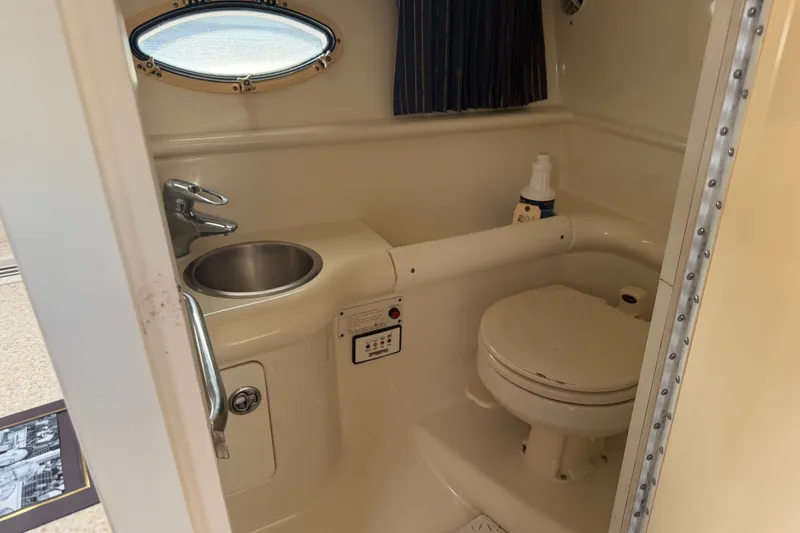 Slide: The Image of 2003 Formula 330 Sun Sport boat bathroom with sink and toilet. - 33
