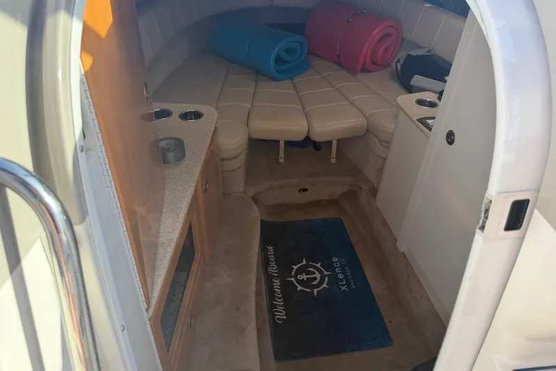 Slide: The Image of Interior of 2003 Formula 330 Sun Sport boat with seating and rolled mats. - 23
