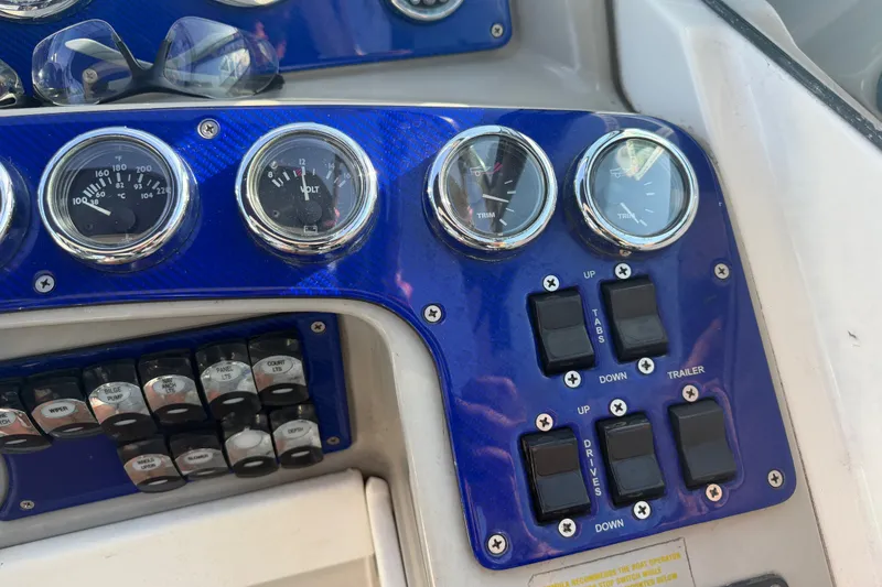 Slide: The Image of Dashboard of a 2003 Formula 330 Sun Sport boat with gauges and switches. - 20