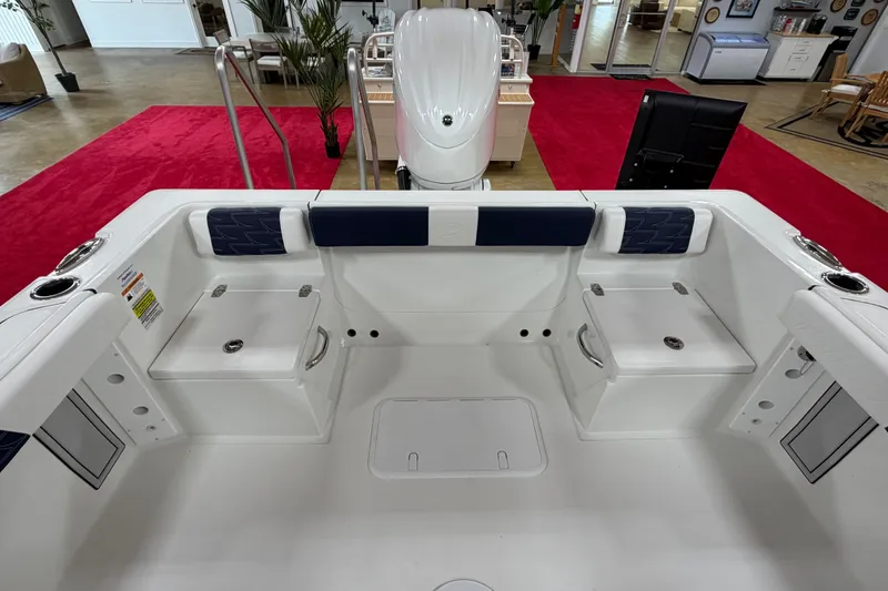 Slide: The Image of Interior view of 2027 Parker 240 Coastal Elite boat, featuring seating and storage compartments. - 11