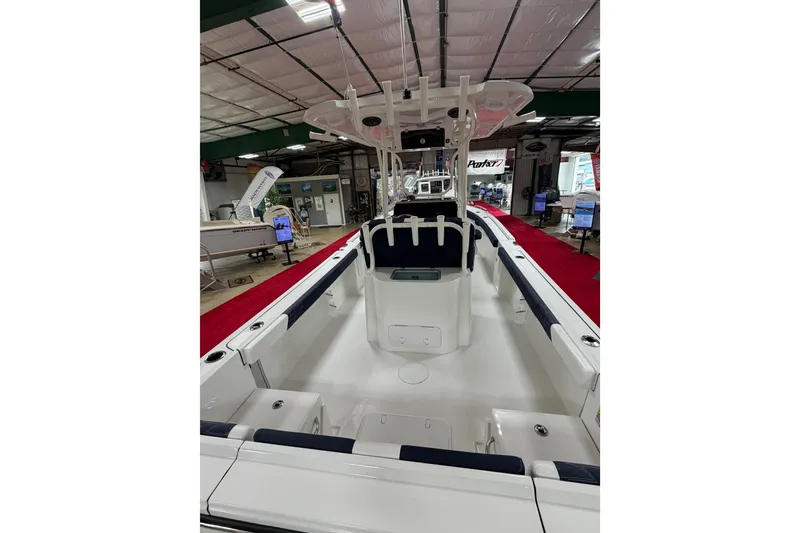 Slide: The Image of 2027 Parker 240 Coastal Elite boat interior at a showroom, featuring sleek design and modern amenities. - 8
