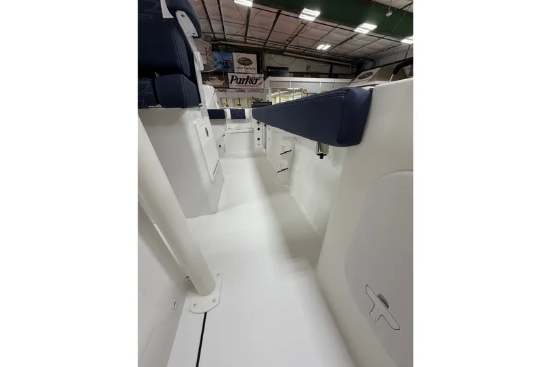 Slide: The Image of Interior view of 2027 Parker 240 Coastal Elite boat, showcasing seating and storage. - 19